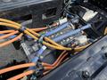 Close-up of the electric motor and wiring of a 2022 Lion Lion6 with orange and blue cables connected to the motor unit