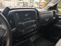 Interior dashboard of a 2016 GMC Sierra 1500 featuring a touchscreen display and control knobs