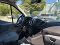 Interior view of a 2016 Ford Transit 150 showing the driver's seat dashboard and controls