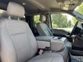 Interior of a 2017 Ford F-550 featuring grey cloth seats with headrests and a center console in between the front seats