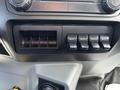 Dashboard control panel of a 2016 Ford F-750 featuring four auxiliary switches labeled AUX 1 to AUX 4