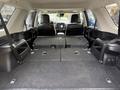 The interior of a 2021 Toyota 4Runner with the rear seats folded down showing a spacious cargo area with a flat surface and no obstructions