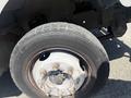 Close-up of a 2009 Workhorse W62 truck wheel showing a silver rim and visible lug nuts on a black tire