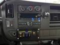 Dashboard of a 2019 Chevrolet Express featuring climate controls audio system and various switches