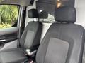 Two black front seats of a 2019 Ford Transit Connect with fabric upholstery and headrests visible in the foreground