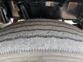 Close-up of a tire from a 2020 Peterbilt 330 showing tread patterns and wear on the surface
