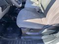 Interior view of the driver's side seat in a 2018 Ford F-150 showing fabric upholstery and a simple design