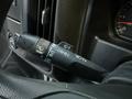 A control lever on the steering column of a 2017 GMC Sierra 3500HD with symbols for headlights turn signals and windshield wipers