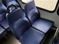 Two blue vinyl seats with a textured surface designed for a vehicle interior