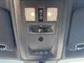 The interior overhead console of a 2018 RAM 3500 featuring two overhead lights control buttons and a switch for the dome light