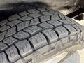 Close-up of a thick tire tread from a 2008 Ford Econoline showing deep grooves and a well-defined pattern