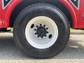 The image shows the large black tire of a 2012 International 7300 Workstar mounted on a white rim with a distinct tread pattern
