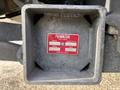 A metallic square lift capacity plate with a red label displaying the model number serial number and weight capacity information