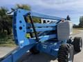A blue 2012 Genie Z 45/25 telescopic boom lift with large black tires and a gray engine cover standing on a paved surface
