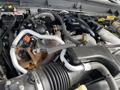 Close-up view of the engine compartment of a 2015 Ford F-550 showing various engine components and hoses