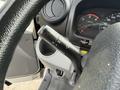 Close-up of the control lever and dashboard of a 2018 Hino 195 featuring speedometer and gauge displays