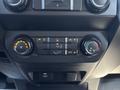 2019 Ford F-150 interior controls including air conditioning settings and fan speed knobs