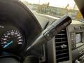 Close-up of the gear shift lever in a 2020 Ford F-550 displaying the drive mode selector with indicators for manual gear change