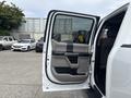 A 2017 Ford F-150 with an open front door showcasing the interior door panel and handle