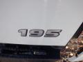Close-up view of the model number 195 on a white 2015 Hino truck