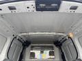 Interior view of a 2019 Ford Transit Connect cargo van with exposed metal framework and ceiling lights