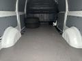 Interior view of a 2021 Mercedes-Benz Metris van showing an empty cargo area with two spare tires in the back