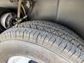 Close-up of a tire from a 1976 GMC Palm Beach showing its tread pattern and sidewall detail