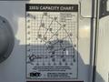 A capacity chart for the 3203i system, detailing load handling distances and weights for a 2010 Ford F-550