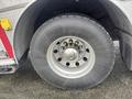 Close-up of a 2006 E-One Typhoon fire truck tire showing a Michelin brand tire with a silver rim and five circular bolt openings