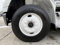 Close-up of a white wheel with a Goodyear tire mounted on a 2005 Freightliner M2 106 vehicle