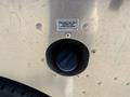Close-up of the fuel filler opening of a 2009 Morgan Olson Workhorse W62 showing a cap marked for unleaded fuel only