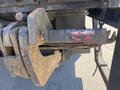 Close-up of a rusty hitch mounted on a 2014 International TerraStar showing wear and a faded red paint marker design