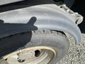 A close-up of the tire and fender of a 2019 Hino 195 showing the tread pattern and rim details