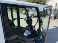 2017 Madvac LS100 street sweeper with an open cabin displaying the steering wheel and control panel inside