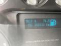Dashboard display of a 2015 Ford F-550 showing trip information fuel gauge and total kilometers driven
