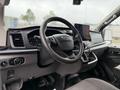 Interior view of a 2022 Ford Transit showcasing the steering wheel dashboard and control panel with a central display screen