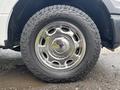 Close-up of a chrome wheel rim on a tire from a 2020 Ford F-150 showcasing the tread pattern and shiny surface