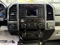 Dashboard of a 2017 Ford F-450 Super Duty featuring a central display screen with controls for media navigation climate and audio adjustments