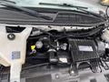 A 2020 Chevrolet Express engine showing components including the air intake system coolant reservoir and various hoses and connections