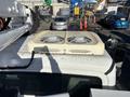 A 2005 Freightliner M2 106 truck with two large cooling fans mounted on the roof