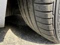 Close-up view of a worn tire from a 2004 BMW 6-Series showing tire tread and surface dirt
