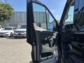 A 2025 Ford Transit T-350 with the driver's side door open showcasing the interior and dashboard design