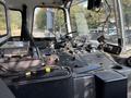 Interior dashboard of a 2011 Autocar Xpeditor showing controls gauges and steering wheel