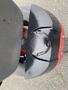 Top view of a 2017 Ferris Rotary mower featuring a shiny black engine cover with a circular cap at the center and a portion of the red body visible below