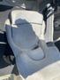 A light gray boat seat from a 2013 Larson 238 featuring ergonomic contours and a smooth surface