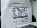 A 2008 Ford F-550 with a vehicle identification number label detailing specifications and manufacturing information