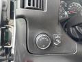 Dashboard controls of a 2018 Chevrolet Express including a headlight switch and an interior light dimmer switch