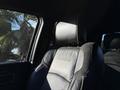 A black leather seat in a 2023 RAM 3500 with a prominent headrest featuring the brand name embossed on it