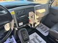 Interior view of a 2013 International 7500 showing the dashboard controls cup holder and floor mats with a thank you message