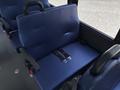 A navy blue bench seat with a seatbelt in a 2020 Chevrolet Express interior
